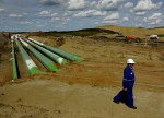 HARDISTY, ALBERTA - JUNE 21: Bryan Templeton is facilities manager at the Keystone facility. The pipes at left are literally the ones that will connect the existing Keystone operation with the new expanded Keystone XL (AKA Keystone B) which is under construction. A massive construction project is well underway on what is known as Keystone B, (AKA Keystone XL) the expansion of the existing Keystone oil pipeline. (Photo by Michael S. Williamson/The Washington Post