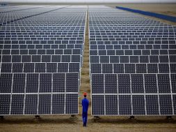 File photo of a worker inspecting solar panels at a solar farm in Dunhuang, 950km northwest of Lanzhou, Gansu Province