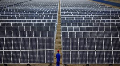 File photo of a worker inspecting solar panels at a solar farm in Dunhuang, 950km northwest of Lanzhou, Gansu Province