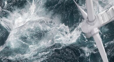 Aerial panorama of a close up wind turbine in the sea