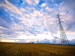 high-voltage-post-with-field-sky 2
