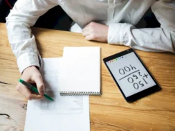 cropped-photo-businessman-white-shirt-working-wooden-table-1200-px