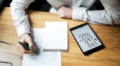 cropped-photo-businessman-white-shirt-working-wooden-table-1200-px