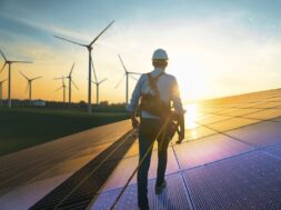 Professional,Male,Green,Energy,Engineer,Walking,On,Solar,Panel,,Wearing